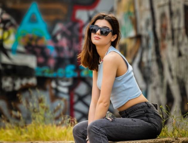 photo-young-cute-lady-sitting-urban-street-looking-camera